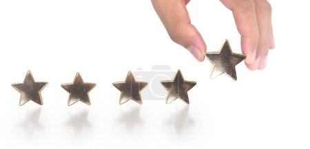 Foto de Aumento en el aumento de cinco estrellas en la mano humana, Aumentar el concepto de clasificación de evaluación de calificación - Imagen libre de derechos