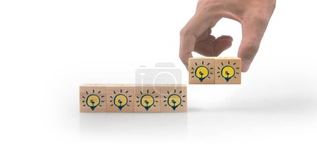 Téléchargez les photos : Wooden cubes in a hand with copy space for input wording - en image libre de droit