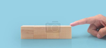 Photo for Wooden cubes in a hand with copy space for input wording - Royalty Free Image