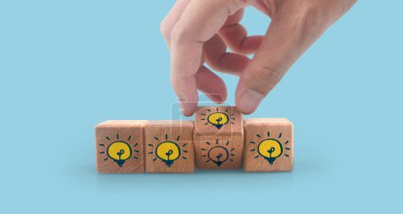 Photo for Wooden cubes in a hand with copy space for input wording and infographic - Royalty Free Image