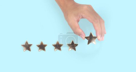 Photo for Rise on increasing five stars in human hand, Increase rating evaluation classification concept - Royalty Free Image