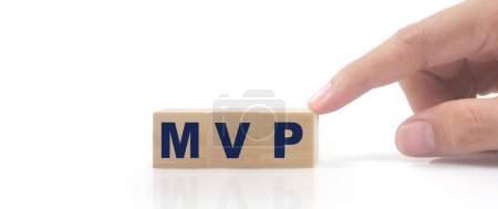 Photo for Wooden cube in hand with the letter from the mvp word . wooden cubes standing - Royalty Free Image
