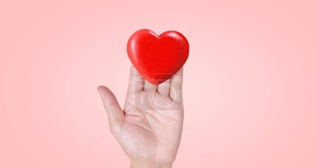 Photo for Hands holding  red heart. heart health donation concepts - Royalty Free Image