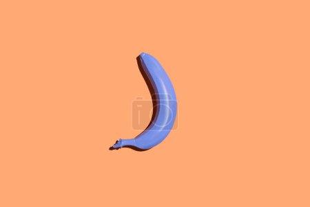 Photo for Minimal top view of single banana in periwinkle blue on pastel background, vegan diet concept, copy space - Royalty Free Image
