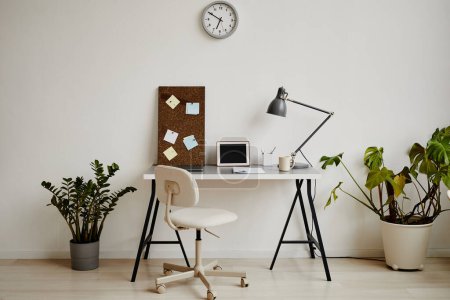 Photo for Background image of minimal home office workplace in white tones decorated with green potted plants, copy space - Royalty Free Image
