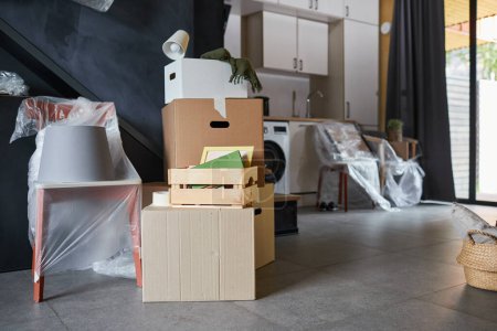 Photo for Close up background image of messy cardboard boxes filled with decor in new home, family moving and relocation concept, copy - Royalty Free Image