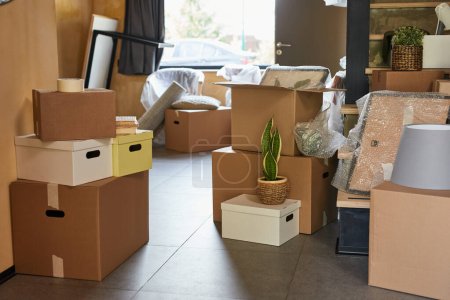 Photo for Background image of hallway in new home filled with cardboard boxes, family moving and relocation concept, copy space - Royalty Free Image
