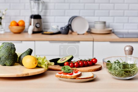 Photo for Image of sandwiches with vegetables on plate with other fresh vegetables on wooden board preparing for cooking - Royalty Free Image