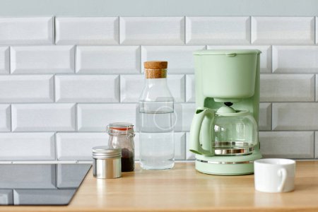 Photo for Minimal background image of home coffee station on wooden kitchen counter in morning, copy space - Royalty Free Image