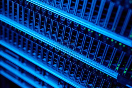 Photo for Background image of blade servers in blue neon light stacked in data center, copy space - Royalty Free Image