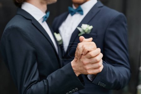 Photo for Close up of two men dancing together during wedding ceremony, same sex marriage - Royalty Free Image