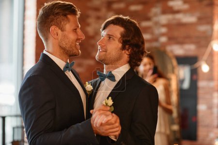 Photo for Waist up portrait of young gay couple dancing together during wedding ceremony, copy space - Royalty Free Image
