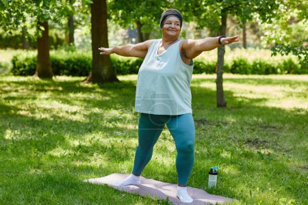 Photo for Full length portrait of overweight black woman working out outdoors in park and smiling, copy space - Royalty Free Image