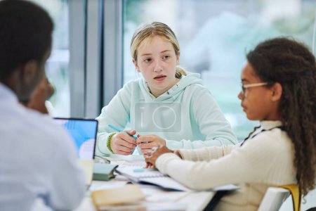 Photo for Minimal portrait of young teenage girl in group activity at school listening to classmates - Royalty Free Image