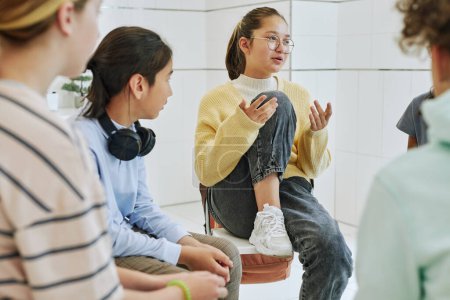 Photo for Portrait of teenage girl sharing feelings in support group circle for children - Royalty Free Image