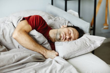 Photo for Mature man lying on pillow under blanket and sleeping in his bed in bedroom - Royalty Free Image