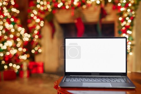 Photo for Close up of laptop screen mockup in festive room decorated for Christmas, copy space - Royalty Free Image