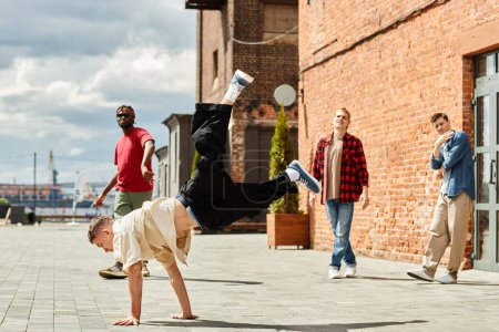 Photo for Full length motion shot of male breakdancing team performing outdoors in city lit by sunlight, copy space - Royalty Free Image