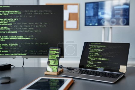 Photo for Background image of computer screens with green code lines at programmers workplace - Royalty Free Image