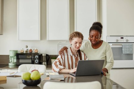 Photo for Portrait of two young women using laptop together at home while managing small business, copy space - Royalty Free Image