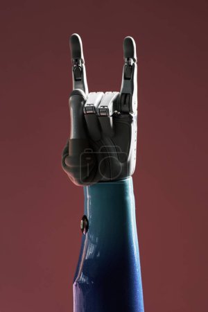 Photo for Bionic hand showing rock sign, music and artificial intelligence concept - Royalty Free Image