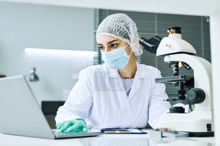 Photo for Portrait of Middle Eastern young woman as female scientist working in medical laboratory - Royalty Free Image