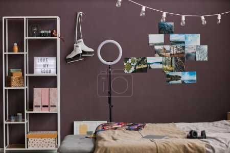 Photo for Background image of teenagers room interior with hobbie items on maroon wall, copy space - Royalty Free Image
