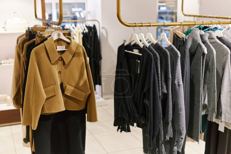 Photo for Background image of clothing racks with Autumn fashion collection in boutique shop, copy space - Royalty Free Image