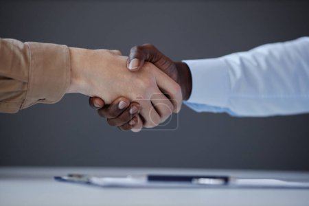 Photo for Unrecognizable candidate shaking hands with recruiter at job interview, copy space - Royalty Free Image