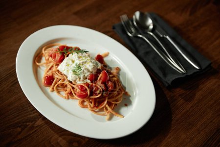 Photo for Close-up of pasta on the plate on table serving for lunch in the restaurant - Royalty Free Image
