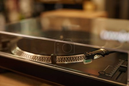 Closeup of brand new vinyl record player on display in music store, copy space