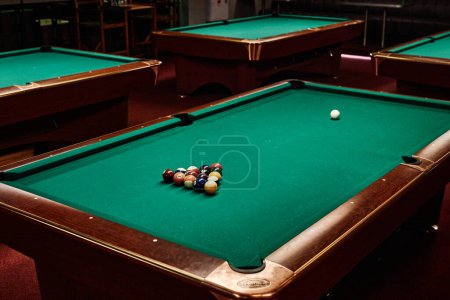 Photo for Background image of green pool table in low light with no people copy space - Royalty Free Image