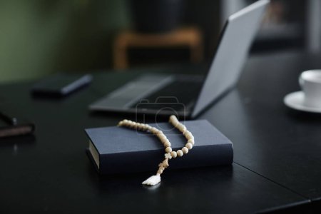 Photo for Close up of rosary over Bible on workplace desk in office, copy space - Royalty Free Image