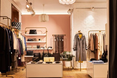 Photo for Background image of elegant clothing boutique interior with clothes and accessories on display, copy space - Royalty Free Image