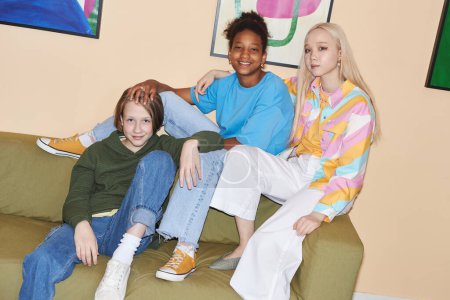 Photo for Fashion portrait of teenagers wearing colorful casual clothes indoors, shot with flash - Royalty Free Image