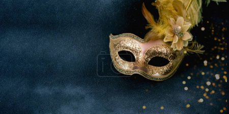 Carnival mask on vintage background with sparkles. Mardi Gras concept or New Years decoration. Concept festive background or design. 
