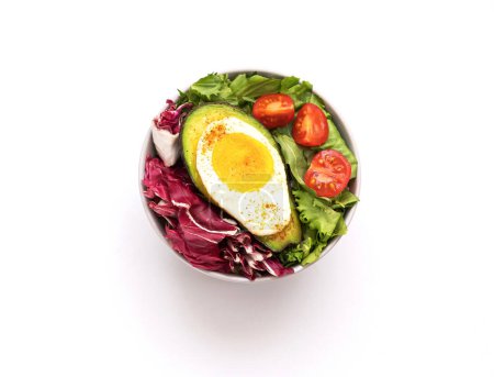 Baked egg with avocado. Bowl from healthy and balanced products. Fodmap diet concept. Close-up