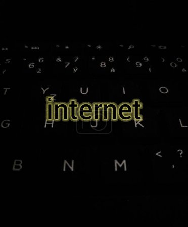 The word internet on a dark background with letters of the English alphabet.