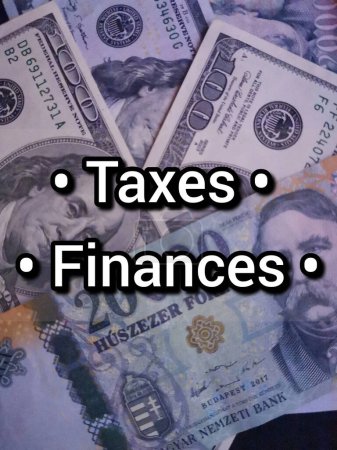 The words Taxes Finances on a background of banknotes