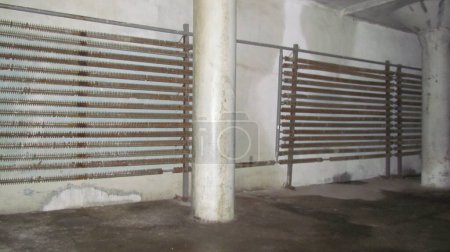 Photo for Cast iron radiators. Heating elements. Rusty warehouse batteries - Royalty Free Image