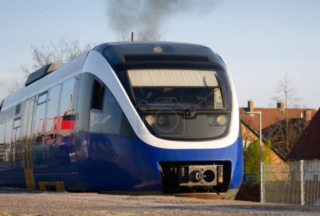 German regional train against the backdrop of houses. High quality photo