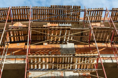 Photo for Construction site with building and scaffolding, close up - Royalty Free Image