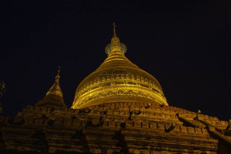 Photo for Night scene of the Shwezigon golden pagoda, famous for its gold-leaf stupa in Bagan, ancient city of Myanmar, Burma - Royalty Free Image