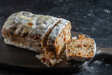 Photo for Christmas stollen, traditional German bread for holiday pastry dessert . Close up - Royalty Free Image