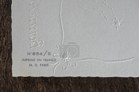 Foto de Original antique back side postcard with the words France, Paris, close up. French Christmas retro card from the seventies, top view, copy space, back blank reverse side - Imagen libre de derechos