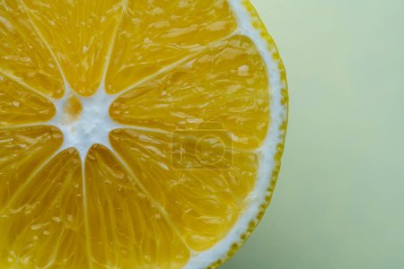Photo for Ripe half of lemon citrus fruit on yellow background, close up, top view, copy space - Royalty Free Image