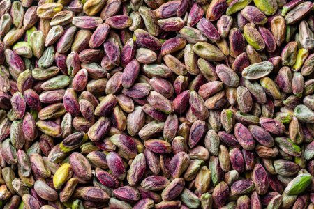 Photo for Pile pistachio kernels nuts without shell, close up. Pistachios without shell, top view. Whole nut kernels - Royalty Free Image