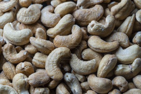 Photo for Pile cashew nuts without shell, close up, top view. Whole nut kernels - Royalty Free Image