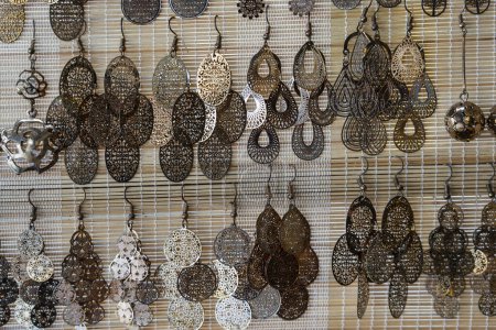 Téléchargez les photos : Handmade earrings for sale for tourists at the street market in Hoi An old town, Vietnam, close up - en image libre de droit