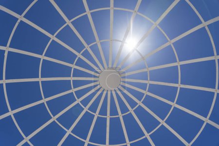 Photo for View on metal gazebo above blue sky on sunny summer day, close up - Royalty Free Image